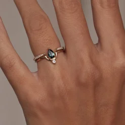 Tomfoolery Medium Pear Cut Teal Sapphire & Diamond Nestled Ring Fashion